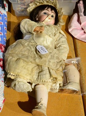 Lot 1417 - A Jumeau bisque.socket head doll, impressed '7', with fixed blue eyes, brown wig, open mouth,...