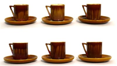 Lot 18 - Christopher Dresser for Linthorpe Pottery: A Set of Six Cups and Saucers, shape No.640, mustard and