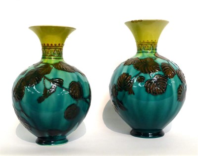 Lot 32 - A Matched Pair of Linthorpe Pottery Vases, shape No.1810, decorated with leaves, on a turquoise and