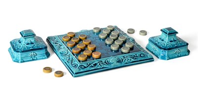 Lot 40 - A Leeds Fireclay Co. Ltd Draughts Board and Twenty-Eight Draughts Pieces, the board moulded...