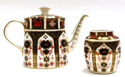 Lot 54 - A Royal Crown Derby Imari teapot, together with a Royal Crown Derby Imari ginger jar and cover (2)