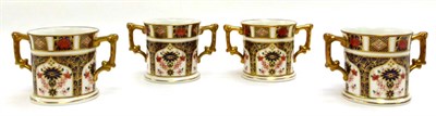 Lot 78 - A set of four Royal Crown Derby Imari twin handled cups, all pattern number 1128