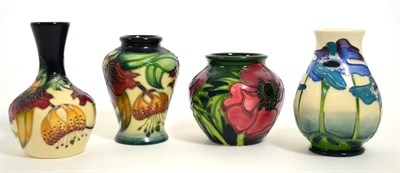 Lot 101 - Four modern Moorcroft miniature vases, various designs, dates and sizes (4)