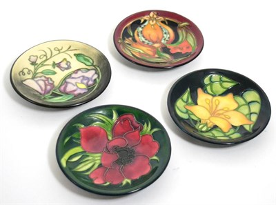 Lot 102 - Four modern Moorcroft dishes, various designs and dates, all 12cm diameter (4)