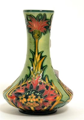 Lot 104 - A modern Moorcroft Crimson Cornflower trial pattern vase, designed by Nicola Slaney, 10cm (boxed)