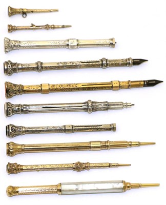 Lot 110 - A collection of ten Victorian yellow, white metal and other cased propelling pens/pencils&nbsp