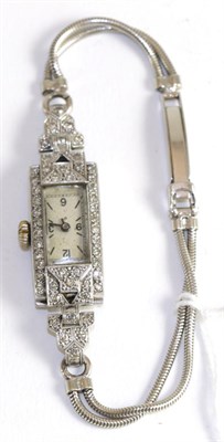 Lot 139 - A lady's diamond set wristwatch, case stamped 'plat'