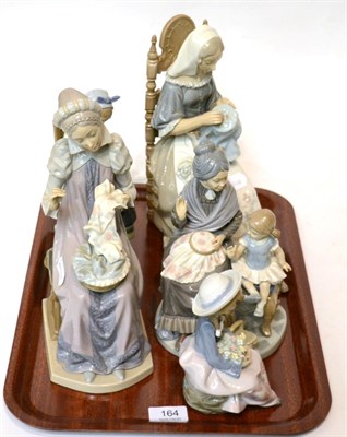 Lot 164 - Five various Lladro figures including lady's seated sewing etc (5)