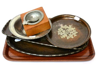 Lot 192 - Three trays, one bowl and a small bowl and spoon with a wooden base, each metal piece stamped...