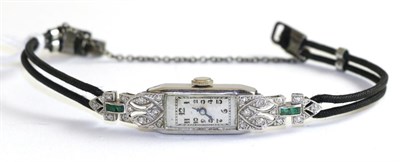 Lot 205 - A lady's diamond and emerald set wristwatch, case inscribed platinum