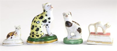 Lot 206 - Group of four Stafforshire cat models, including a leopard (a.f.), frightened cat etc