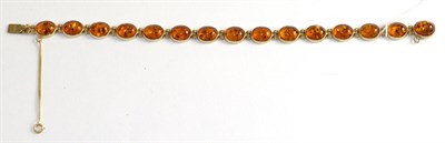 Lot 219 - A 9ct gold amber bracelet