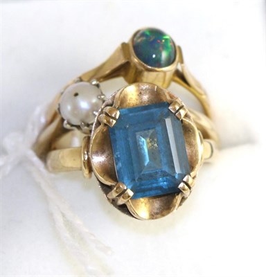 Lot 222 - A blue topaz ring, an opal ring and a pearl ring (3)