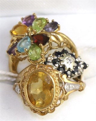 Lot 224 - A 9ct gold multi-gemstone ring, a 9ct gold citrine ring and a 9ct gold sapphire cluster ring (3)