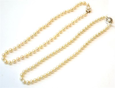 Lot 230 - Two cultured pearl necklaces with pearl set clasps