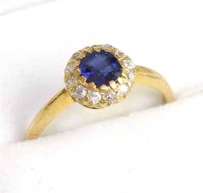 Lot 239 - A sapphire and old cut diamond cluster ring, total estimated diamond weight 0.15 carat...