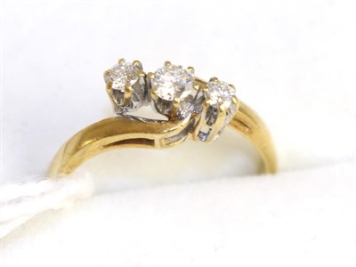 Lot 243 - An 18ct gold diamond three stone ring, 0.25 carat approximately, finger size K