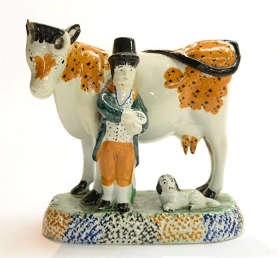 Lot 262 - A Prattware cow group