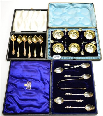 Lot 279 - A set of six cased silver salts and spoons, a set of six cased Gospel spoons, a pair of sugar tongs