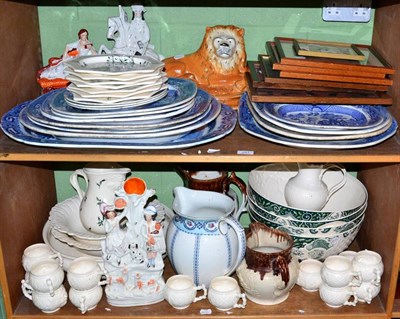 Lot 291 - A quantity of blue and white meat plates, Staffordshire figures, modern creamware, jugs etc