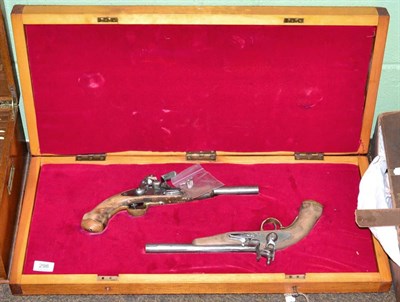 Lot 298 - Two replica Flintlock pistols, in a wood case