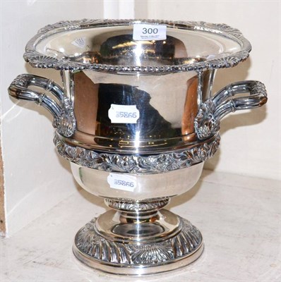 Lot 300 - A large Sheffield plate wine cooler, twin handled, gadrooned rim and base, campania form, 24cm high