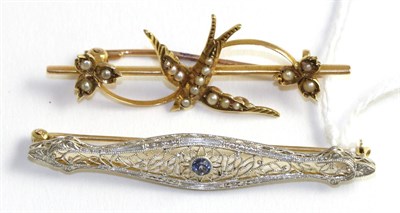 Lot 324 - A sapphire bar brooch, stamped '14K', and a seed pearl swallow brooch, stamped '15CT' (2)