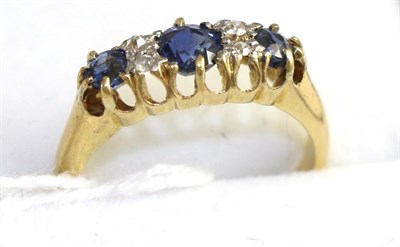 Lot 331 - A sapphire and diamond ring, finger size J1/2 stamped '18CT'