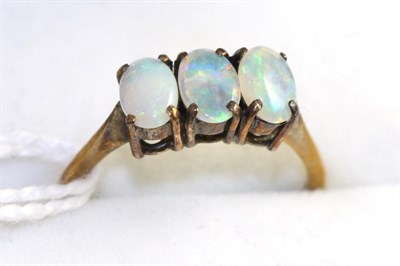 Lot 353 - A 9ct gold cubic zirconia cluster ring and an opal three stone ring (2)