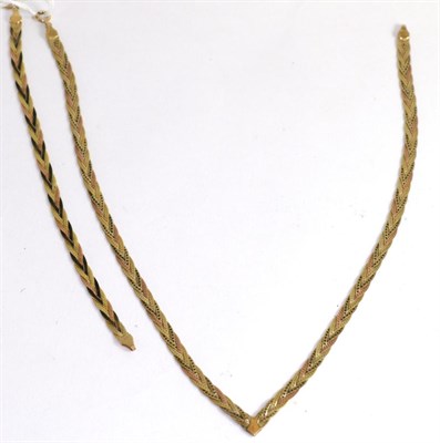 Lot 365 - A three colour 9ct gold necklace and a 9ct three colour gold bracelet