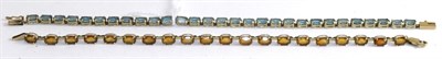 Lot 369 - A 9ct gold citrine line bracelet and a blue topaz line bracelet, stamped '10k' (2)