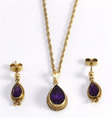 Lot 391 - An amethyst pendant on a Prince of Wales chain and a pair of 9ct gold amethyst drop earrings (2)