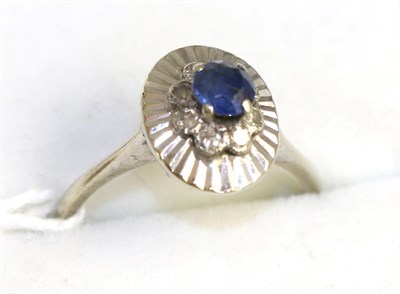 Lot 403 - An 18ct gold sapphire and diamond ring