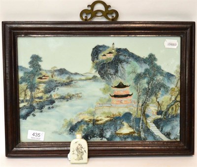 Lot 435 - A Chinese famille-verte porcelain landscape plaque, 24cm by 37cm; together with a snuff bottle (2)