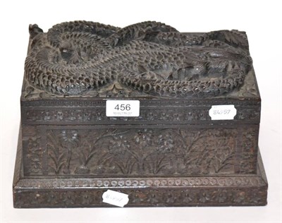 Lot 456 - A South East Asian carved wooden box decorated with a dragon