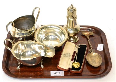 Lot 457 - A small group of silver comprising a Georgian sugar bowl, a sauce boat, another sugar bowl,...