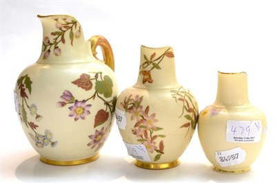 Lot 479 - Three Royal Worcester blush ivory jugs painted with flowers