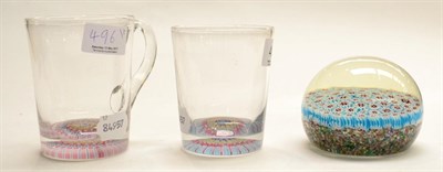 Lot 496 - Two glasses with millefleur bases and a millefiori paperweight