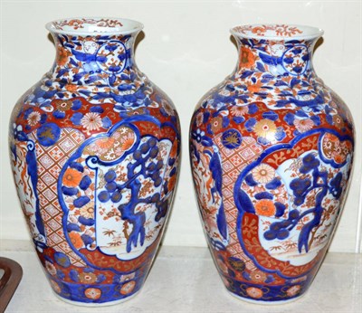 Lot 516 - A pair of Imari baluster vases, 32cm in height (2)