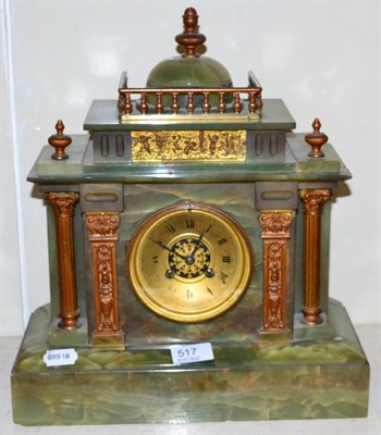 Lot 517 - An onyx mantel clock