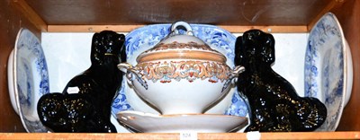 Lot 524 - Three blue and white platters, soup tureen on stand and a pair of black Staffordshire dogs