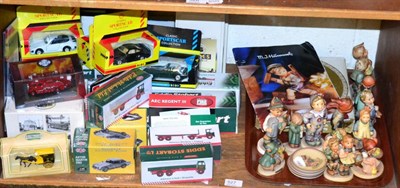 Lot 527 - A collection of Goebel figures, together with some boxed model vehicles