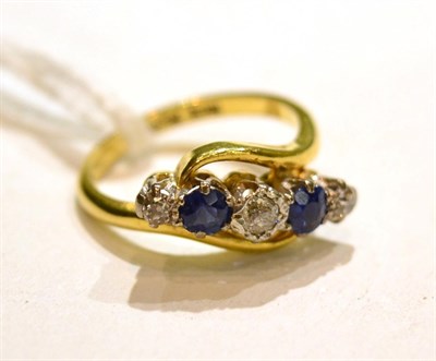 Lot 542 - A sapphire and diamond five stone ring, total estimated diamond weight 0.20 carat...