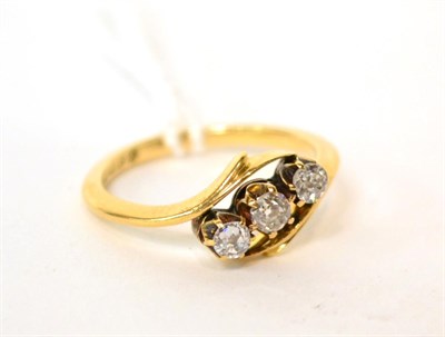 Lot 551 - An 18ct gold diamond three stone ring, 0.30 carat approximately, finger size M1/2