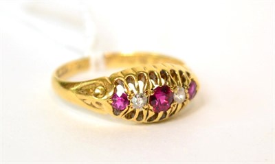 Lot 553 - An 18ct gold ruby and diamond ring, finger size N