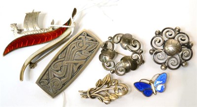 Lot 561 - A collection of eight sterling and white metal brooches including a Norwegian example (8)