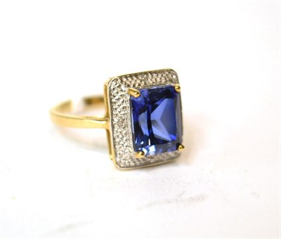 Lot 565 - A 9ct gold synthetic sapphire ring, finger size P1/2