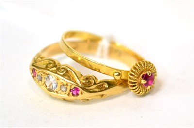 Lot 567 - An 18ct gold ruby, white stone and diamond, finger size P and a ruby set ring, finger size M (2)