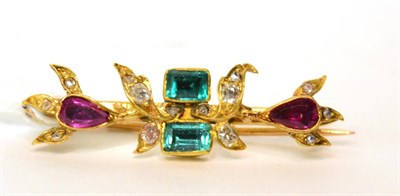 Lot 576 - An emerald, ruby and diamond set brooch