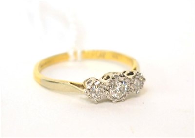 Lot 581 - A diamond three stone ring, 0.25 carat approximately, finger size N1/2